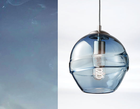 Bluestone glass swatch showcasing handblown glass luminaires in a modern pendant light design.