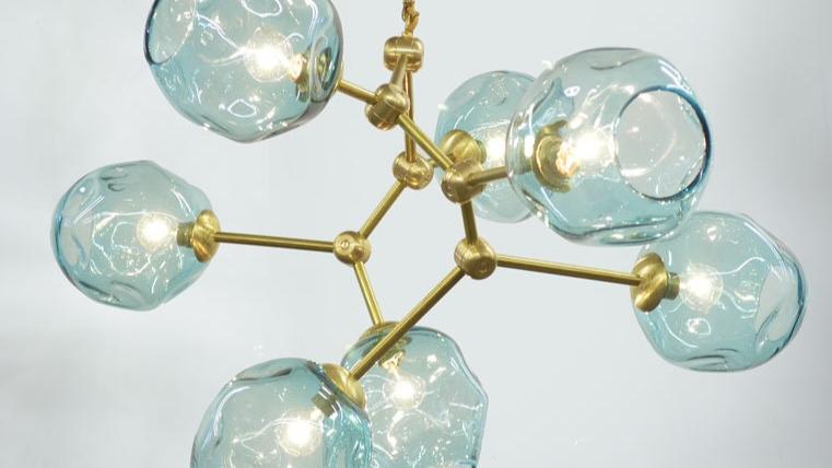 Petra Corinne chandelier featuring handblown glass luminaires with dimmable LED bulbs, elegant brass accents.