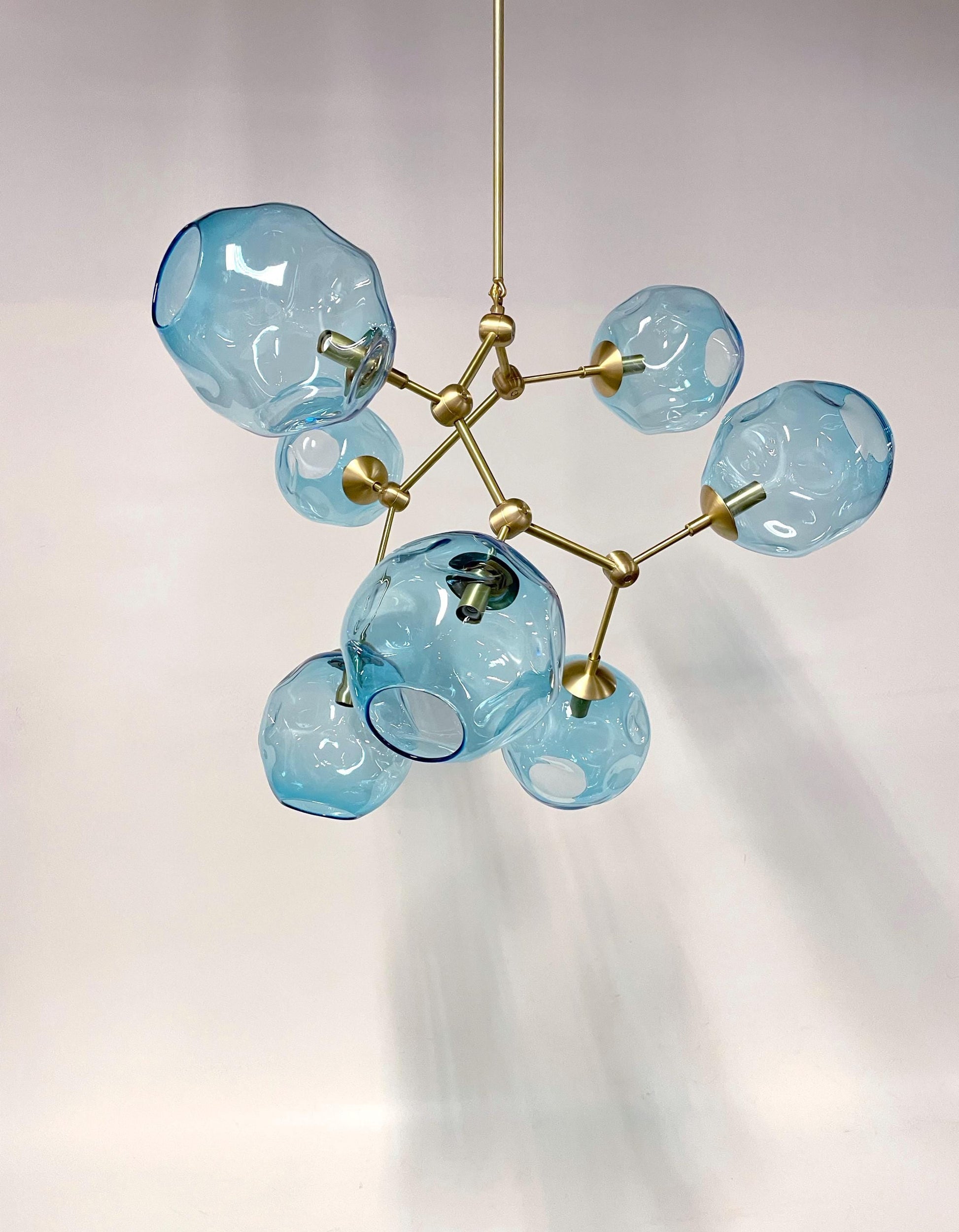 Petra Corinne Chandelier featuring handblown glass luminaires in a stunning blue design.