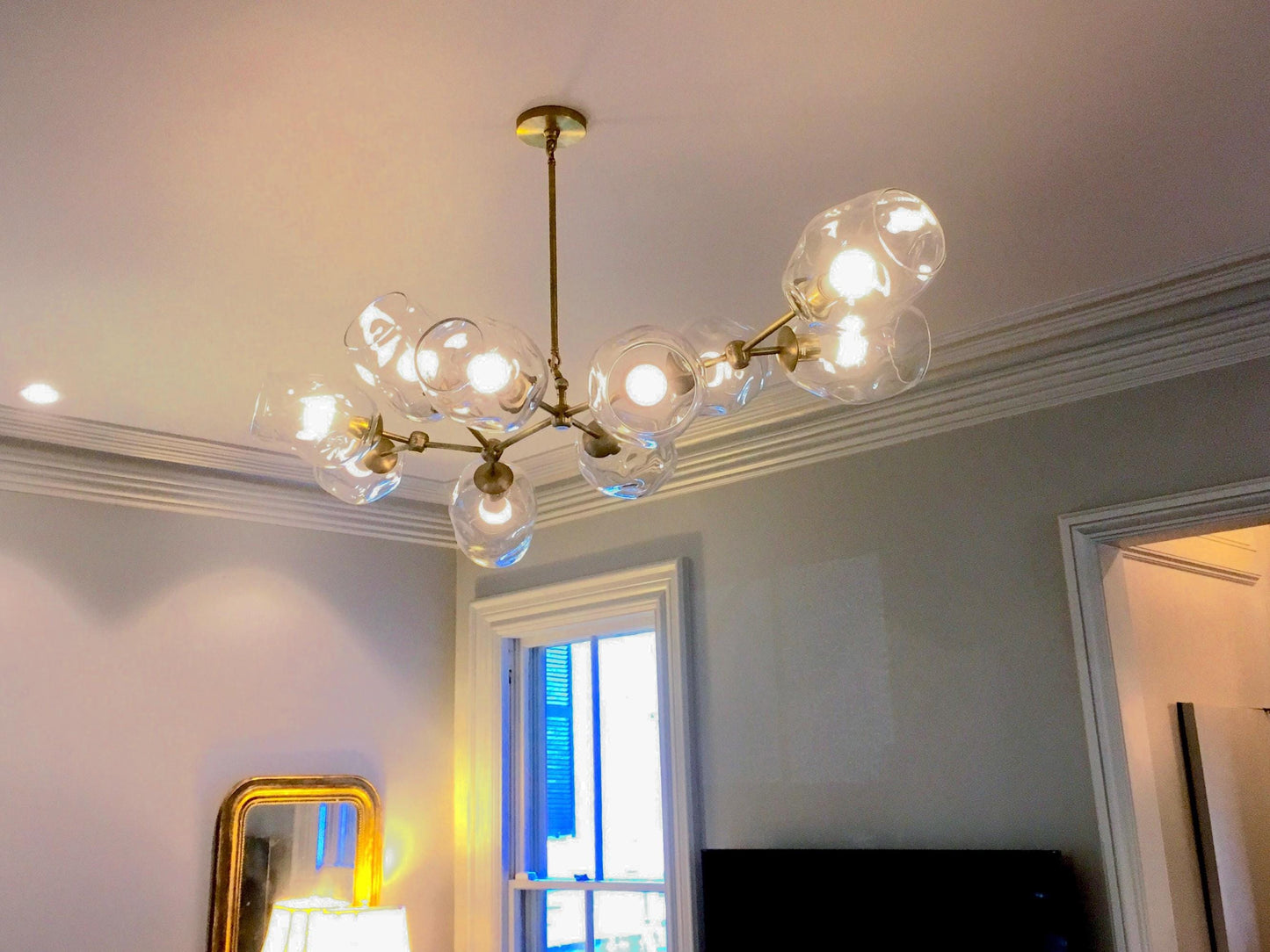 Petra Santina Chandelier featuring handblown glass diffusers and contemporary design in a stylish interior.