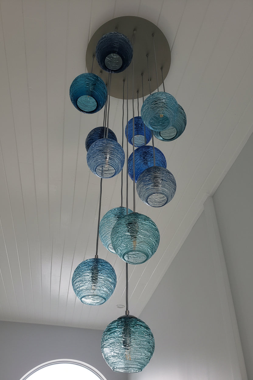 Cascading glass chandelier with a variety of blues 