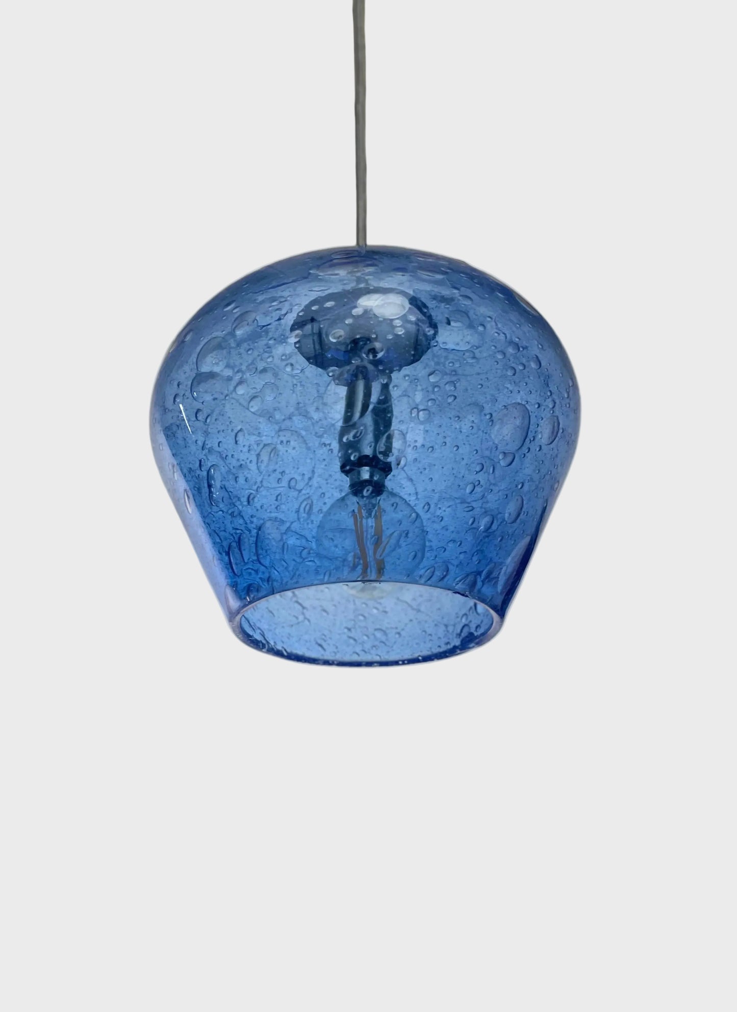 Blue bubble-glass pendant light on a white background