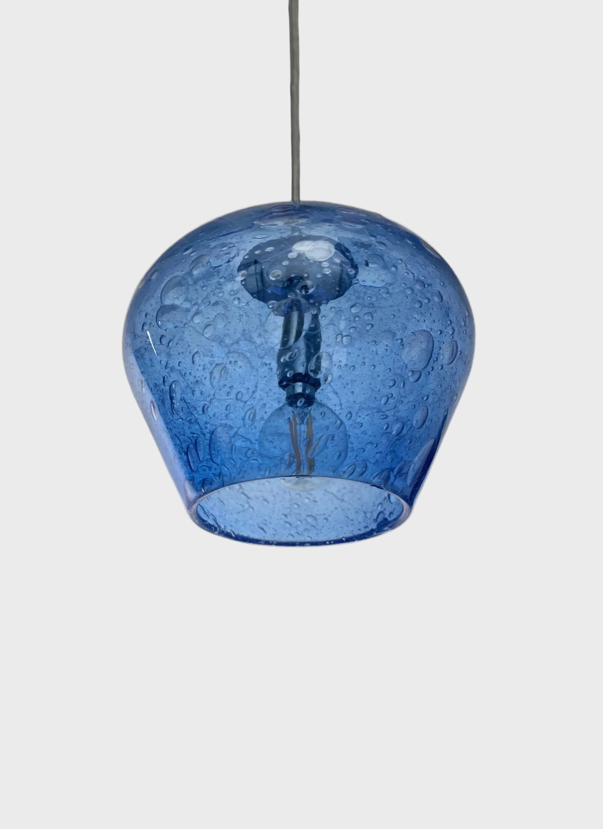 Blue bubble-glass pendant light on a white background